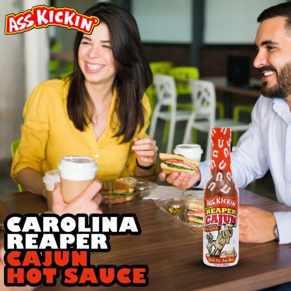 Couple smiling with Cajun Reaper Hot Sauce bottle in front